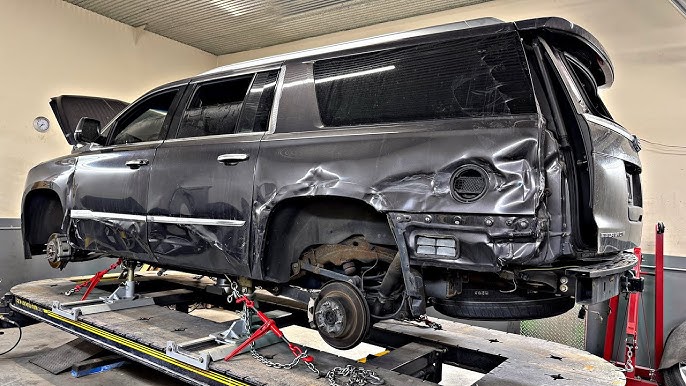 Cadillac vehicle being repaired at Century 1st Auto Body